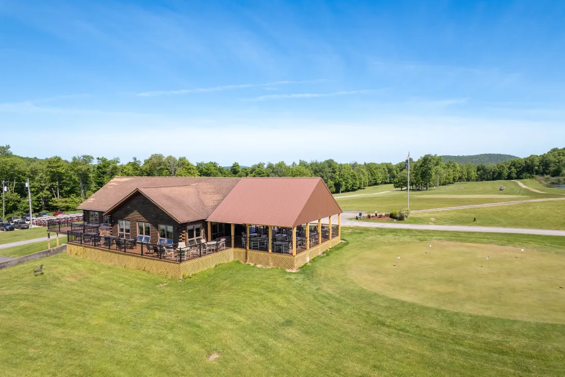 Clubhouse beside the putting green and golf course