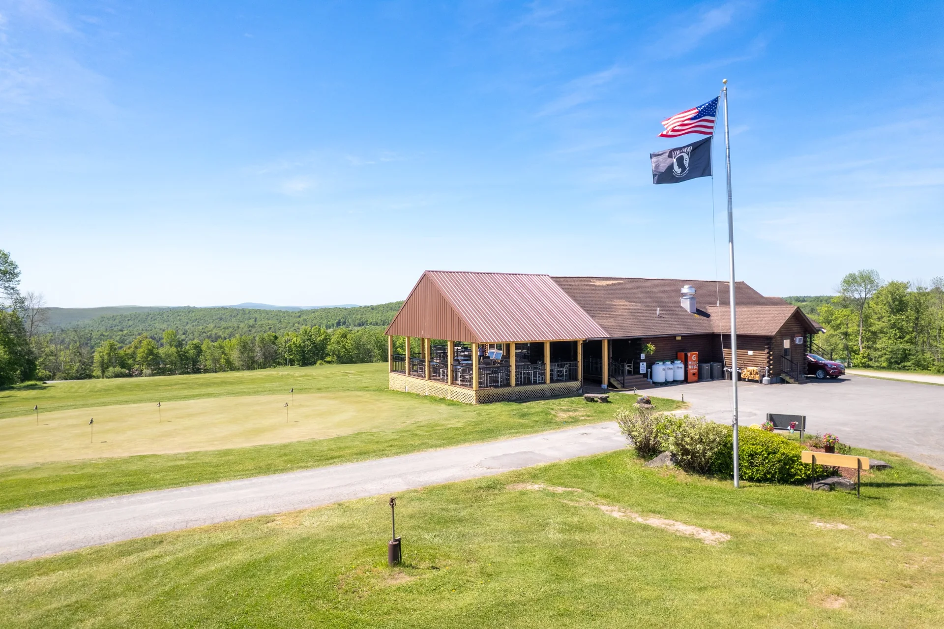 Flag, clubhouse and Catskill mountain views